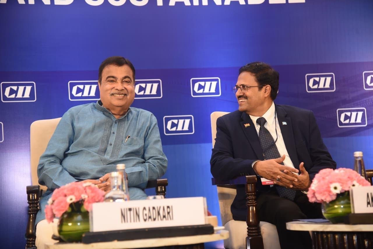Union Minister Nitin Gadkari and Akhilesh Srivastava, President ITS India Forum, on stage at CII Highways of India's Future